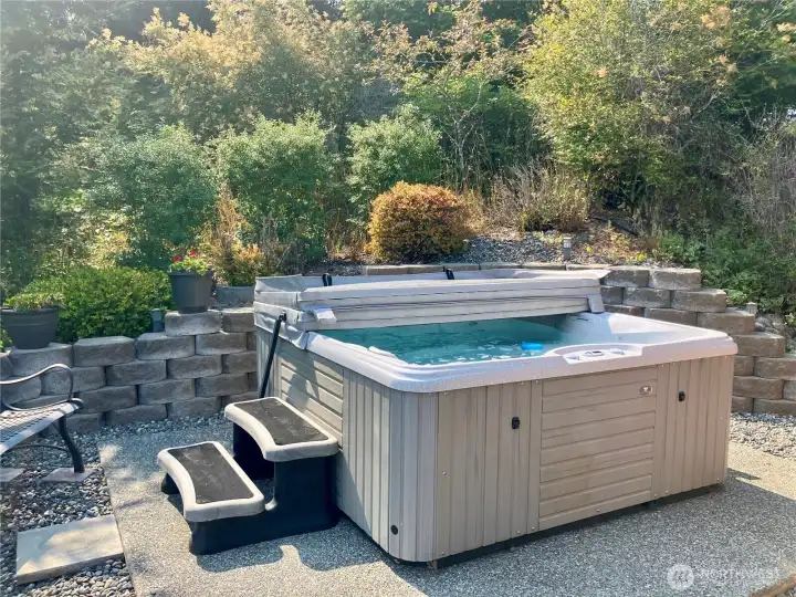 Hot tub looking over gardens and firepit Hot tub looking over gardens and firepit