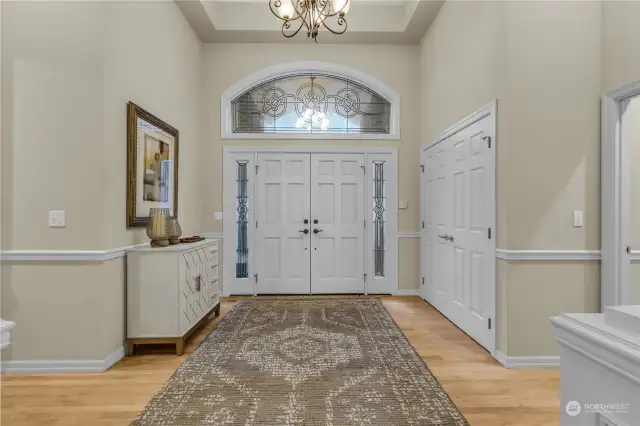 Gorgeous custom cut glass entry with matching window detail in the powder room and large pantry.