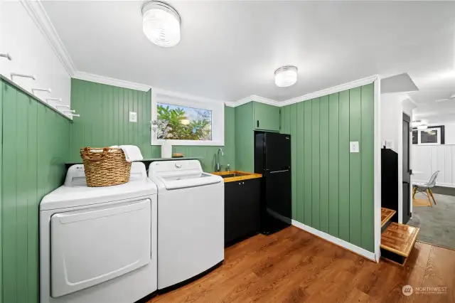 Mudroom and laundry space leads to garage