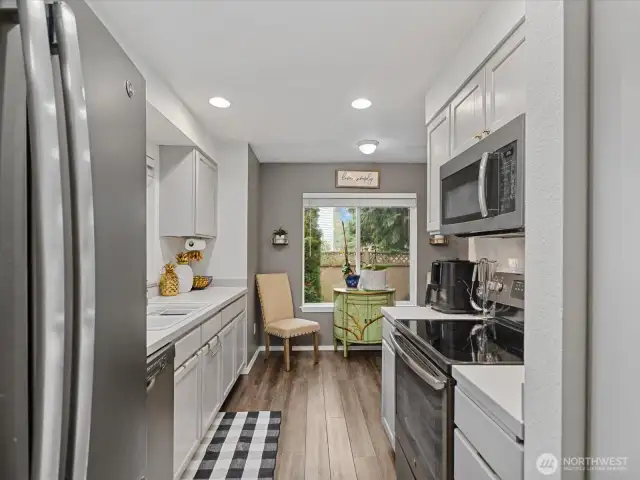 Plenty of cabinets along with full pantry on the right.