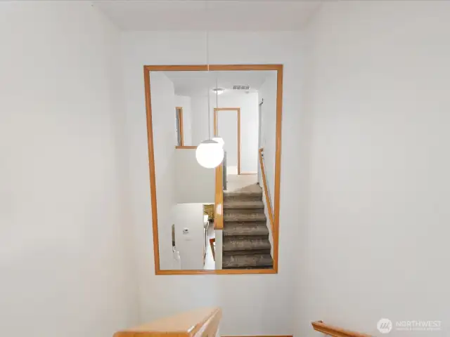 VERY Large mirror at the center of the staircase stays with home.