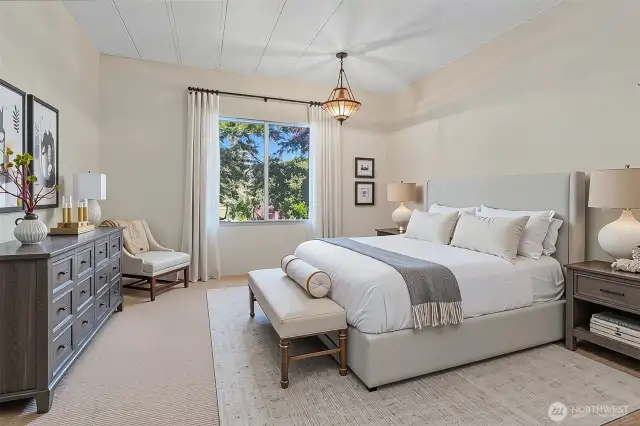 Master bedroom suite with a walk in closet and a 5 piece bathroom.   Virtually staged photo.