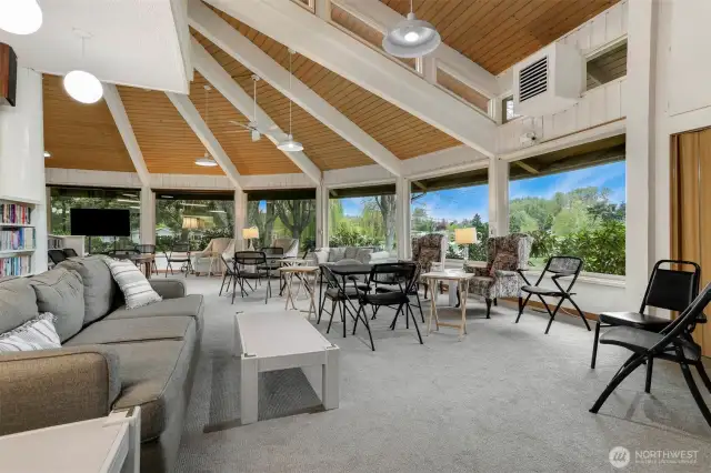 Wandering Creek Common area:  Clubhouse interior lounger overlooking Reflection Lake.