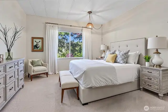Master bedroom suite with a walk in closet and a 5 piece bathroom.   Virtually staged photo.