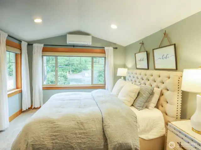 Primary bedroom with ensuite bath. Remote-operated shades with blackout.