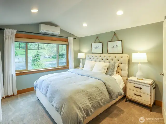 Primary bedroom with ensuite bath. Remote-operated shades with blackout.