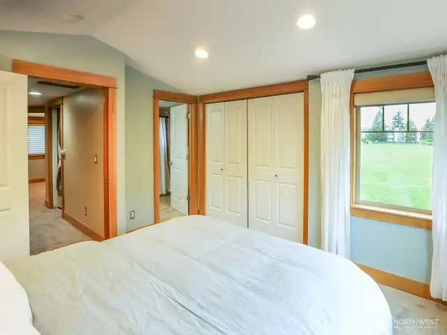 Primary bedroom with ensuite bath. Remote-operated shades with blackout.
