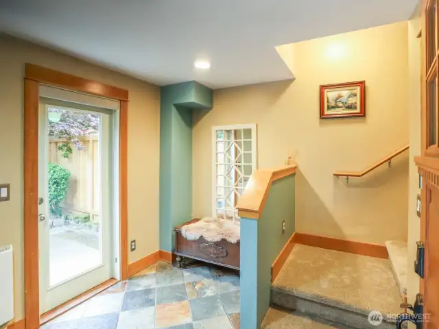 Pleasant entryway/foyer. Access to patio and garage from here.