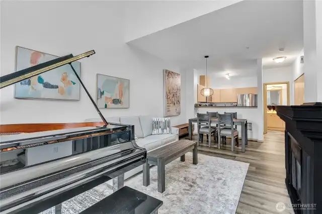 Step into the bright and airy living room featuring an open concept floorplan and slider to the patio.
