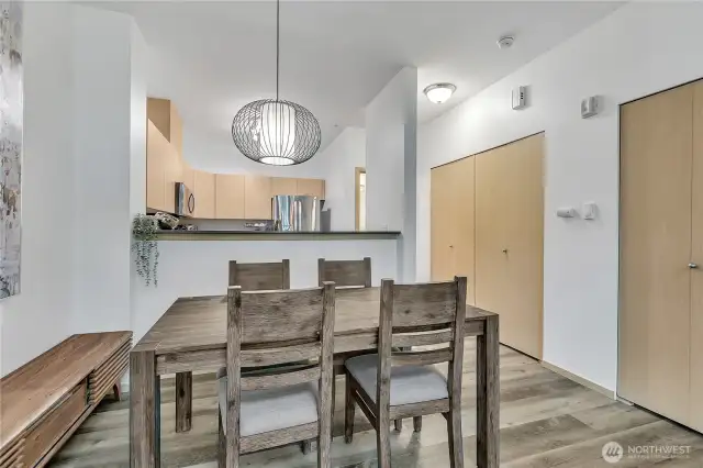 Large and spacious closets along the wall with a stacking washer/dryer.