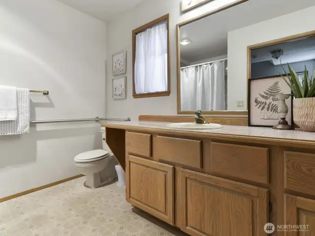 main level full bath , oversize bath tub, wide door + grab bars