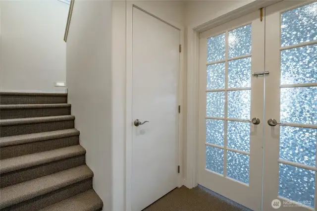 Entry to the garden level. That is a nice size closet under the stairs.