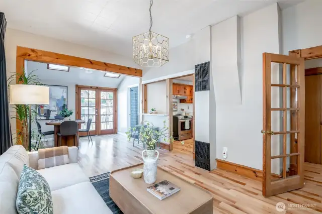 The feel of this space is open and inviting; the kitchen, eating bar, and family room are close, relating to one another.