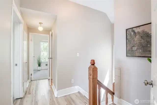 The upstairs landing with a peek at the 3rd bedroom.