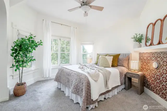 The primary suite is filled with light and pretty windows.