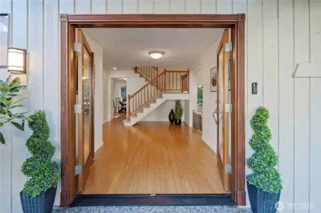 Picture-perfect! From the moment you step through the double doors, you're welcomed by warm bamboo hardwood floors, a beautifully open staircase—offering a glimpse of this thoughtful design home!