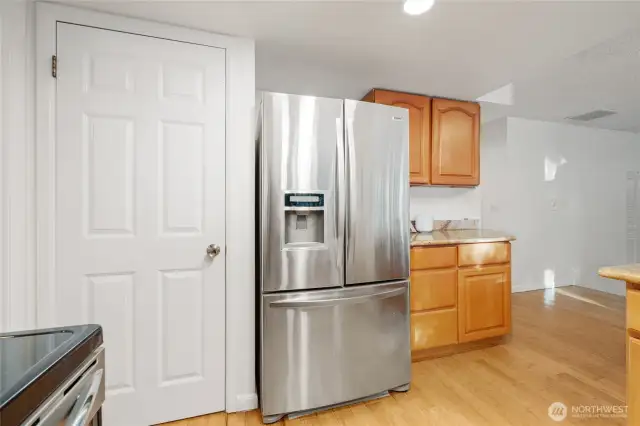 A spacious pantry, along with extra cabinetry and generous counter space, makes meal prep effortless and adds everyday convenience.