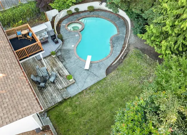This expansive backyard blends lawn, patio, and pool space for effortless entertaining or peaceful weekends at home.