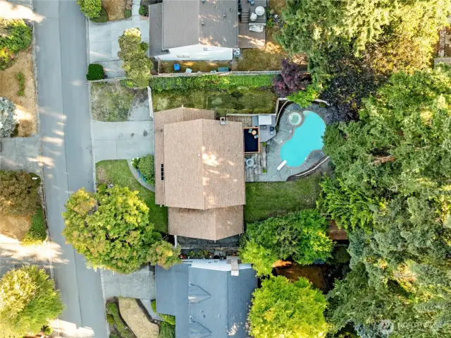 Enjoy a full view and envision the possibilities. Don’t miss the discreet Class A RV parking area—tucked behind a moveable fence for secure, convenient storage without compromising curb appeal. Landscaper's dream of what the lawn could look like.