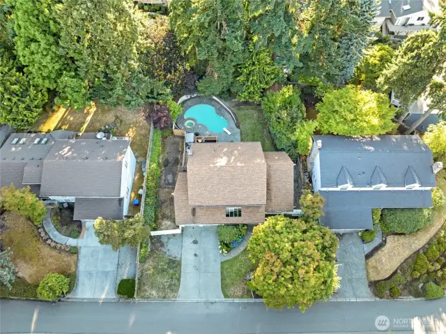 This aerial view showcases the home’s impressive footprint and well-proportioned lot, offering a clear look at the layout, driveway space, and surrounding neighborhood.