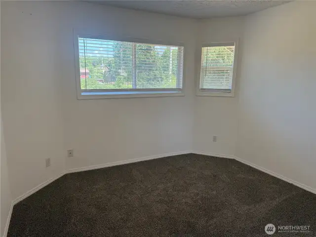 3rd bedroom with carpet.