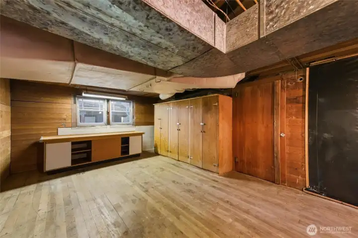 Store room under Unit B; additional storage (dirt floor) through door on right