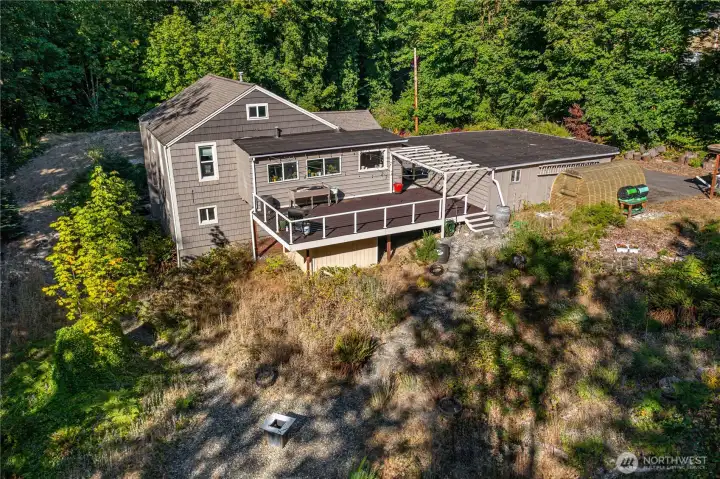 The oversized back deck offers a perfect vantage of the backyard and includes roomy storage space beneath