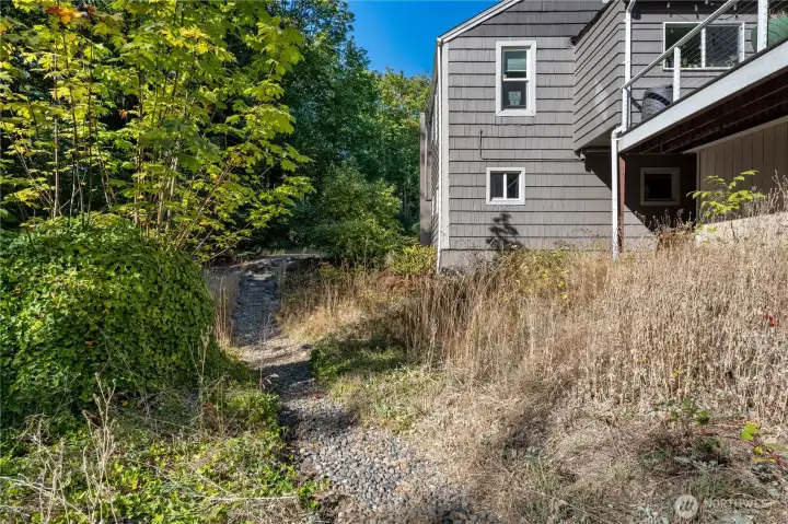 Stone path that connects to downstairs sliding door