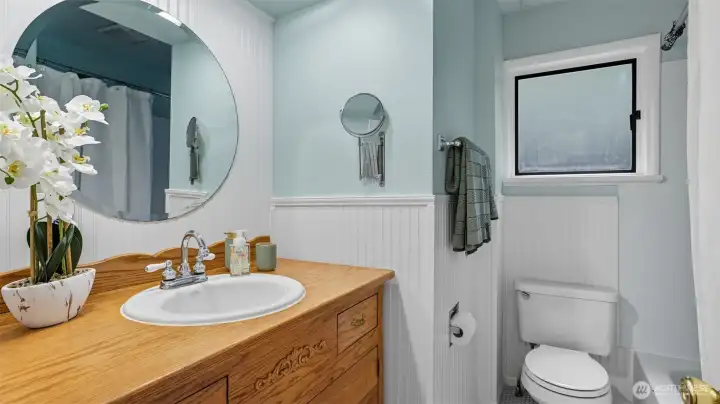 This well-appointed bathroom offers plenty of character and function.