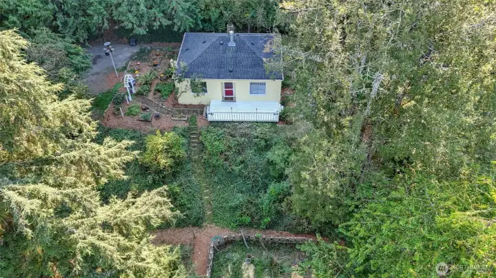 This charming home with surrounding gardens and natural privacy from mature trees.