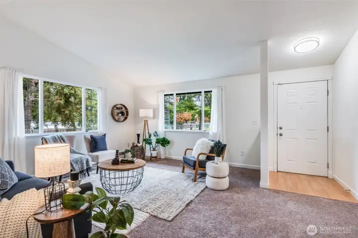 Upon entering, you will find the living room welcoming you with an abundance of natural light.