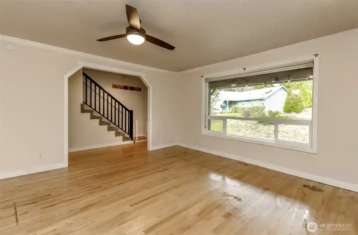 Spacious and open living area sits just off the entrance of the home.