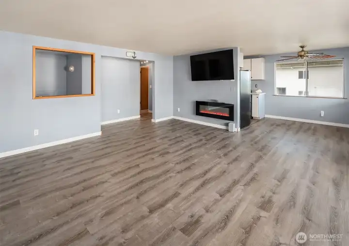 Looking toward kitchen, dining area and hall to bedrooms and bathroom.