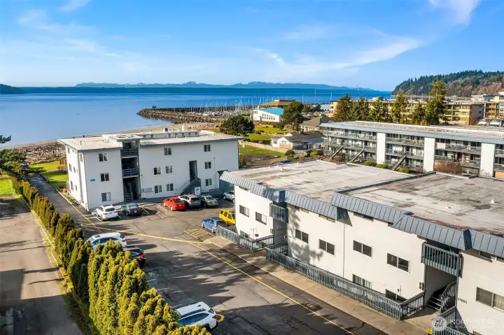 The very convenient assigned parking is where the blue car is.