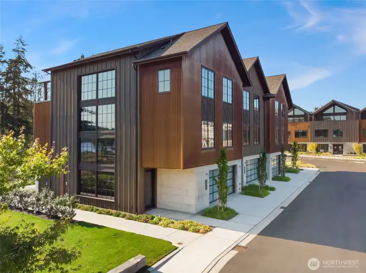 This exceptional south-facing townhome is a refined expression of modern coastal luxury