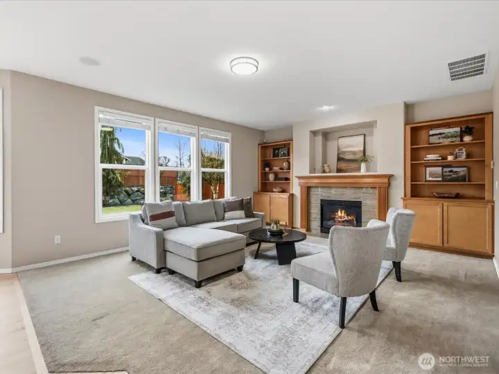 Large family room with fireplace and surround sound.