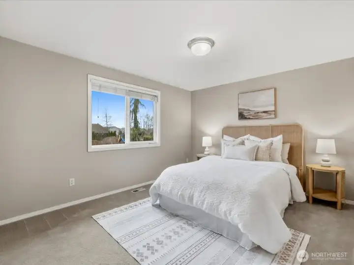 Bedroom #2 overlooks the backyard.