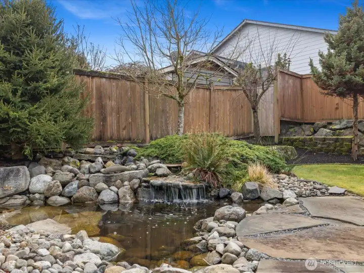 Soothing water feature is highlight of the private backyard.