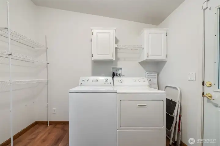 Utility room with back door access to back yard