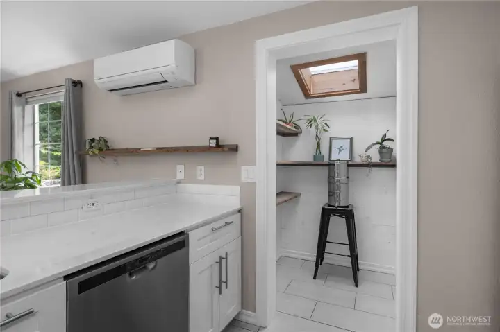 Through this door is the kitchen entry to access the covered walkway to the garage. A great 'drop-zone'.