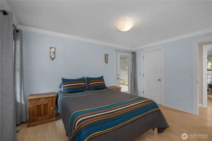 The primary bedroom combines generous space, soft light, and a relaxing retreat-like feel.