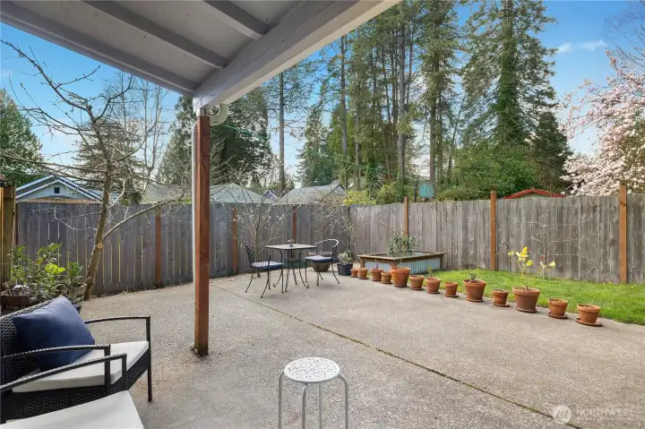 Covered patio area extends the living space and offers year-round outdoor enjoyment.