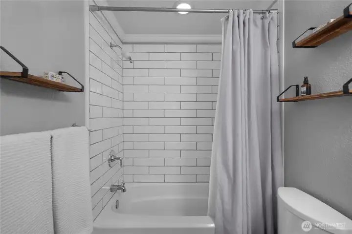 Subway tile tub surround adds a clean, classic finish to the bathroom.