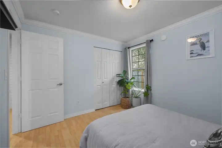 Secondary bedroom includes closet storage and natural light in a clean, versatile space.