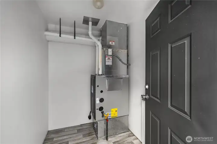 Clean utility area offers room for household organization and systems access. New Hi Eff Gas Furnace!