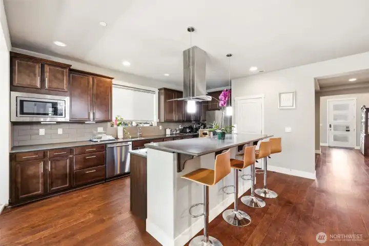 Chef's Ktchen with Garcious Cabinets and a Roomy Storage Pantry