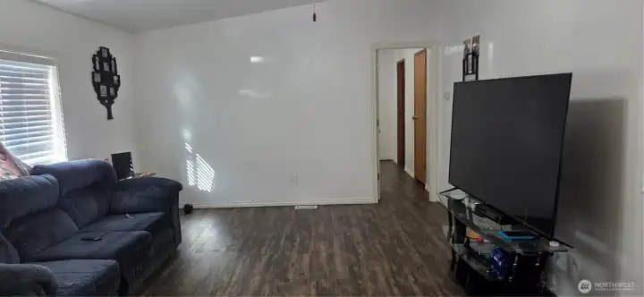 Living room view and entrance to the primary ensuite.