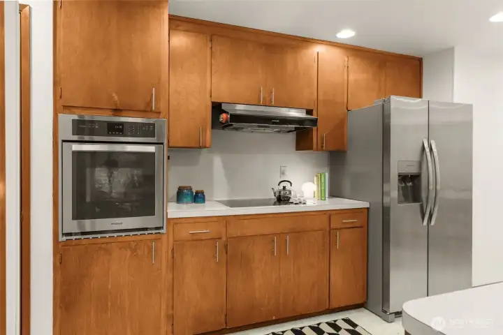 Newer appliances with original cabinets.