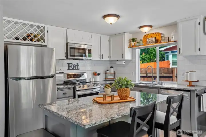 New kitchen with Quartz counters nice island all newer appliances are included walk in pantry.