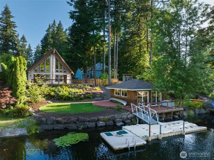 Lake Life! Covington Creek offers a coveted waterfront lifestyle without the hefty Lake Sawyer price tag! Updated custom home ... huge yard ... charming boat house - and desirable floating dock!